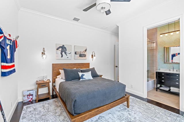 bedroom with dark hardwood / wood-style flooring, ceiling fan, crown molding, and sink