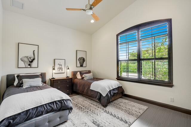 bedroom with ceiling fan and lofted ceiling