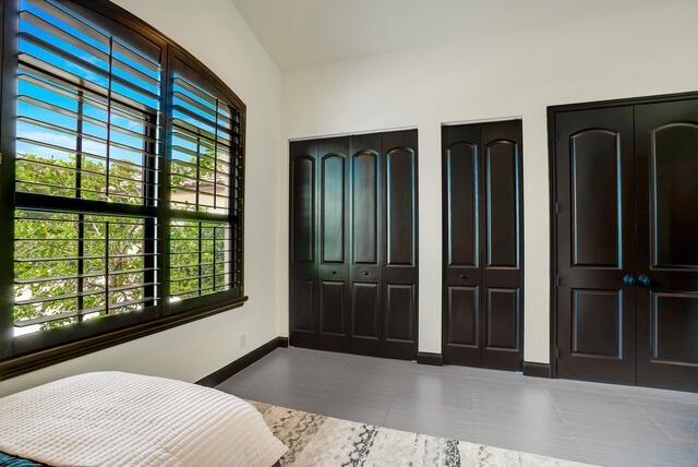 bedroom with two closets