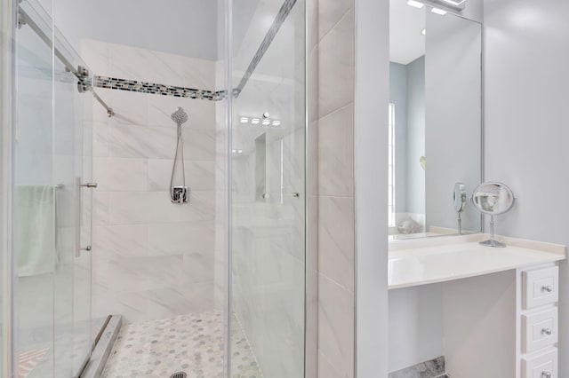 bathroom with vanity and an enclosed shower