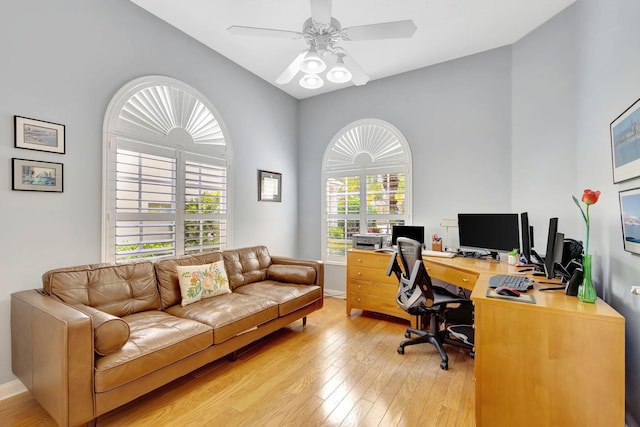 office space with ceiling fan, wood-type flooring, and a wealth of natural light