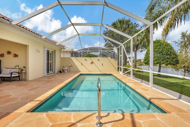 view of swimming pool with a water view, a patio, and a lanai