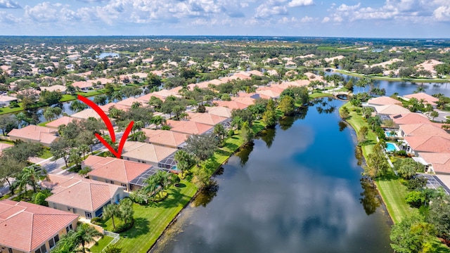 birds eye view of property with a water view