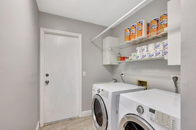 clothes washing area with independent washer and dryer