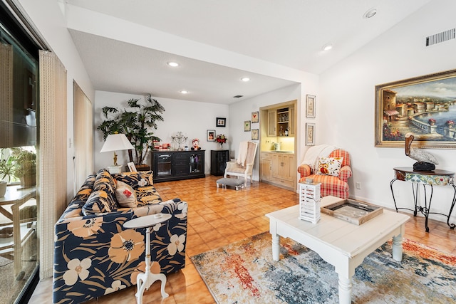 tiled living room with lofted ceiling