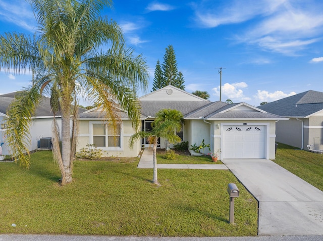 ranch-style home featuring cooling unit, a front yard, and a garage