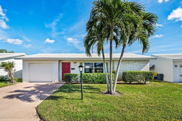 single story home with a garage and a front yard