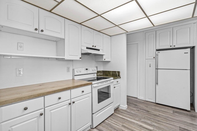 kitchen featuring white appliances, light hardwood / wood-style floors, white cabinetry, and a paneled ceiling