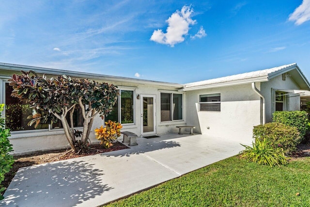 rear view of house featuring a patio area