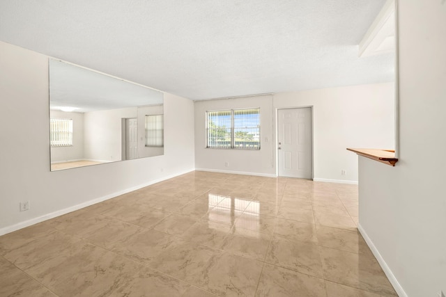 empty room with a textured ceiling