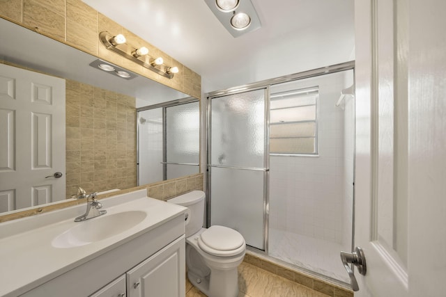 bathroom with vanity, toilet, and walk in shower