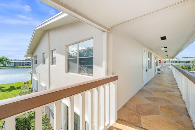 balcony featuring a water view