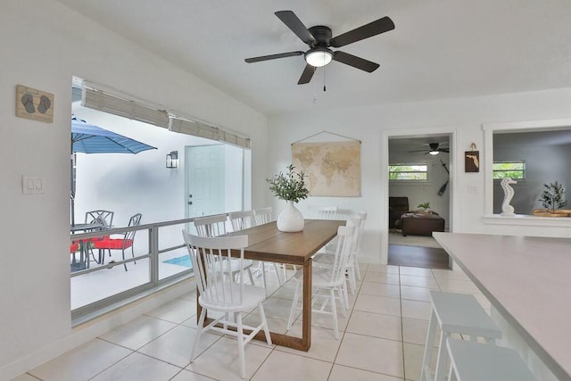 dining area featuring ceiling fan and light tile patterned flooring