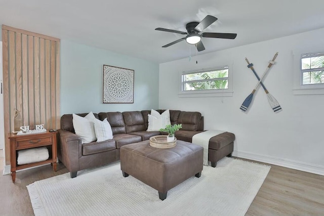 living room featuring ceiling fan and hardwood / wood-style floors