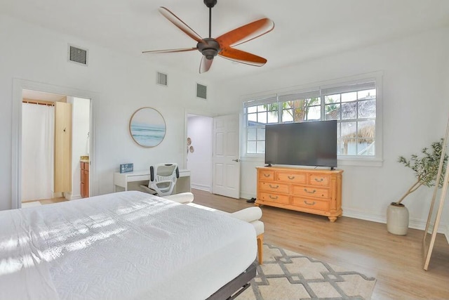 bedroom with light hardwood / wood-style floors and ceiling fan