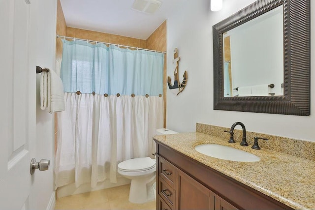 bathroom featuring tile patterned flooring, vanity, a shower with shower curtain, and toilet