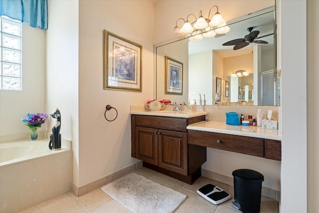 bathroom featuring vanity, tile patterned floors, ceiling fan, and a tub