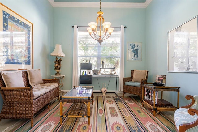 sitting room featuring a notable chandelier, wood-type flooring, and crown molding