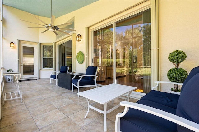 view of patio with outdoor lounge area and ceiling fan