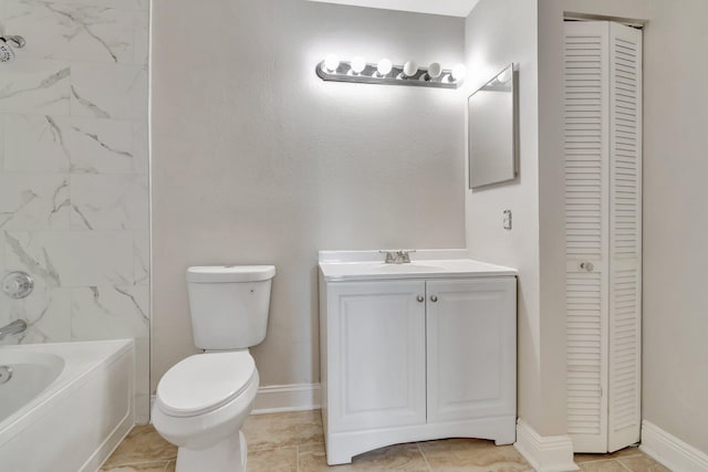 full bathroom with vanity, tiled shower / bath combo, and toilet