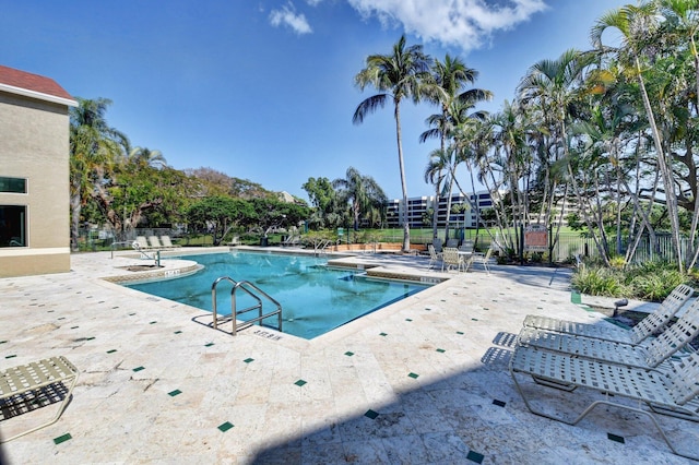 view of swimming pool with a patio