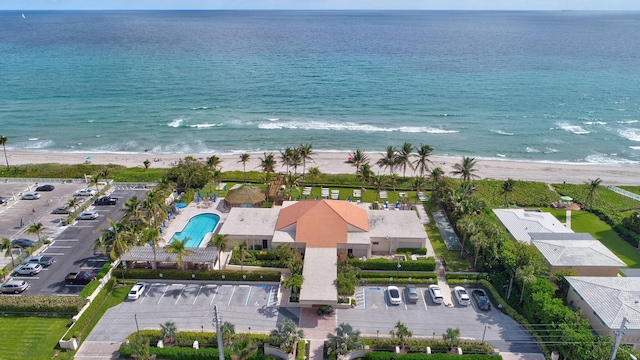 bird's eye view featuring a water view and a view of the beach