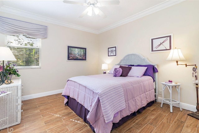 bedroom with light wood-type flooring, ceiling fan, and ornamental molding