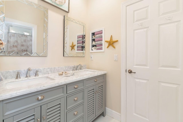 bathroom with tile patterned floors and vanity