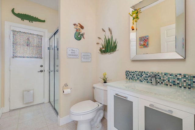 bathroom with tasteful backsplash, tile patterned floors, an enclosed shower, toilet, and vanity