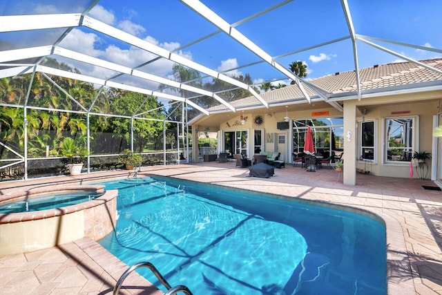 view of pool featuring glass enclosure, an in ground hot tub, and a patio