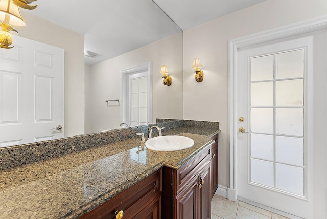 bathroom with tile patterned flooring and vanity