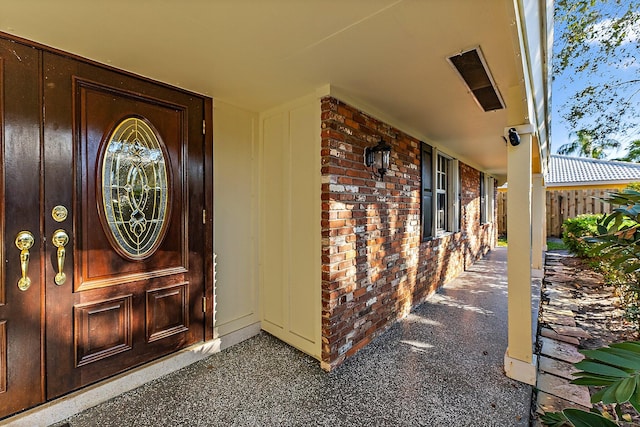 view of exterior entry featuring a porch