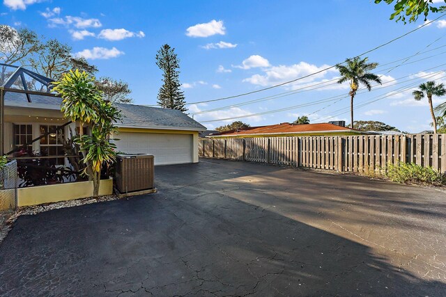 view of swimming pool with a lanai and a patio