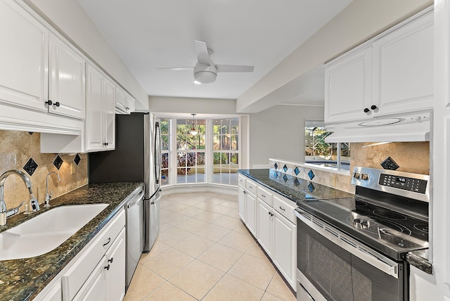 kitchen featuring white cabinets, a healthy amount of sunlight, sink, and stainless steel appliances