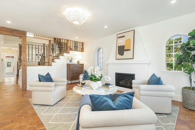 230 Argyle Rd, West Palm Beach, FL 33405 - living area with stairs, a glass covered fireplace, and recessed lighting