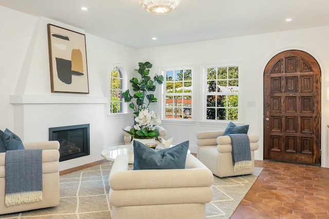 tiled living room with a large fireplace