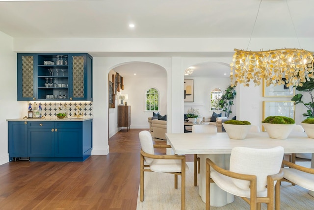 230 Argyle Rd, West Palm Beach, FL 33405 - dining space with arched walkways, dark wood-type flooring, and recessed lighting