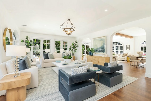 living room with light hardwood / wood-style flooring and french doors