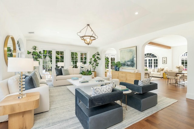230 Argyle Rd, West Palm Beach, FL 33405 - living area with arched walkways, wood finished floors, and recessed lighting