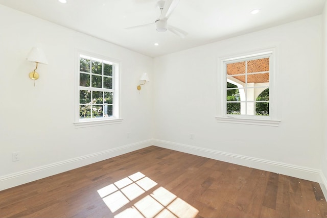 spare room with ceiling fan and hardwood / wood-style flooring