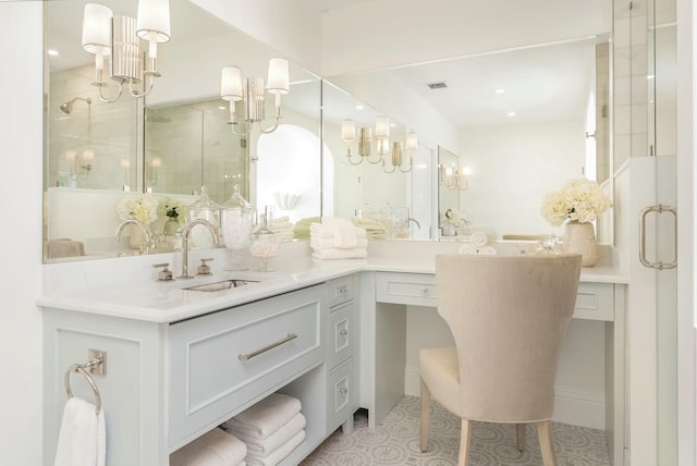 bathroom featuring vanity and a shower with door