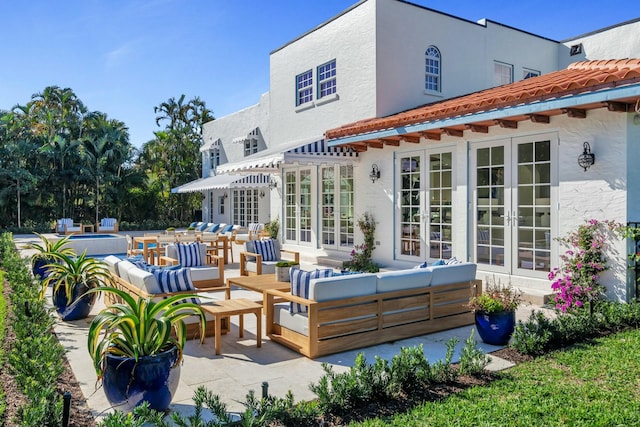 230 Argyle Rd, West Palm Beach, FL 33405 - view of patio / terrace with outdoor lounge area, french doors, and an outdoor pool