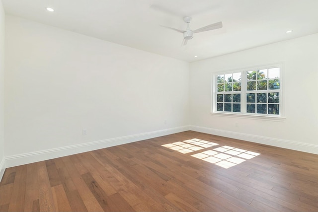 empty room featuring ceiling fan and hardwood / wood-style floors