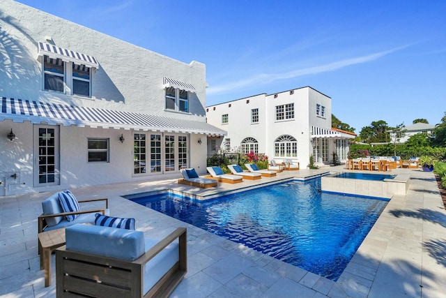 view of pool featuring a patio area