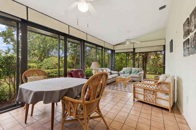 sunroom / solarium with ceiling fan and lofted ceiling