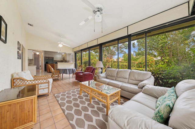 sunroom / solarium featuring ceiling fan and vaulted ceiling