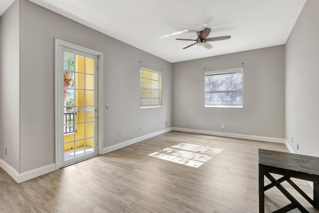 empty room featuring ceiling fan and light wood-type flooring