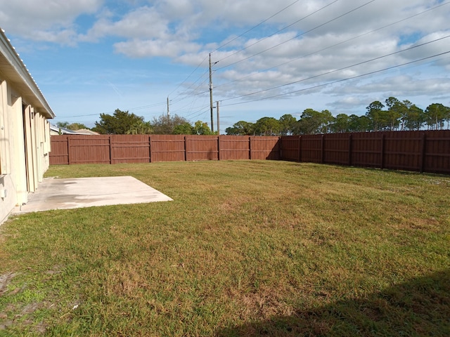 view of yard featuring a patio area and a fenced backyard