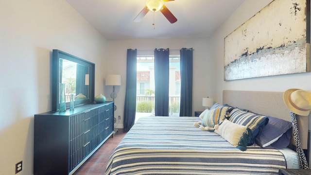 bedroom with wood finished floors, ceiling fan, and baseboards