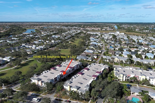 view of property location with a nearby body of water and nearby suburban area